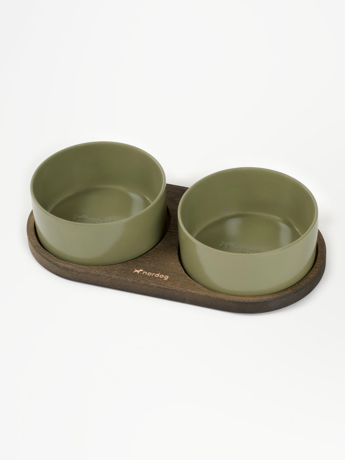 Nordog Barcelona — smoked oak with green ceramic bowls